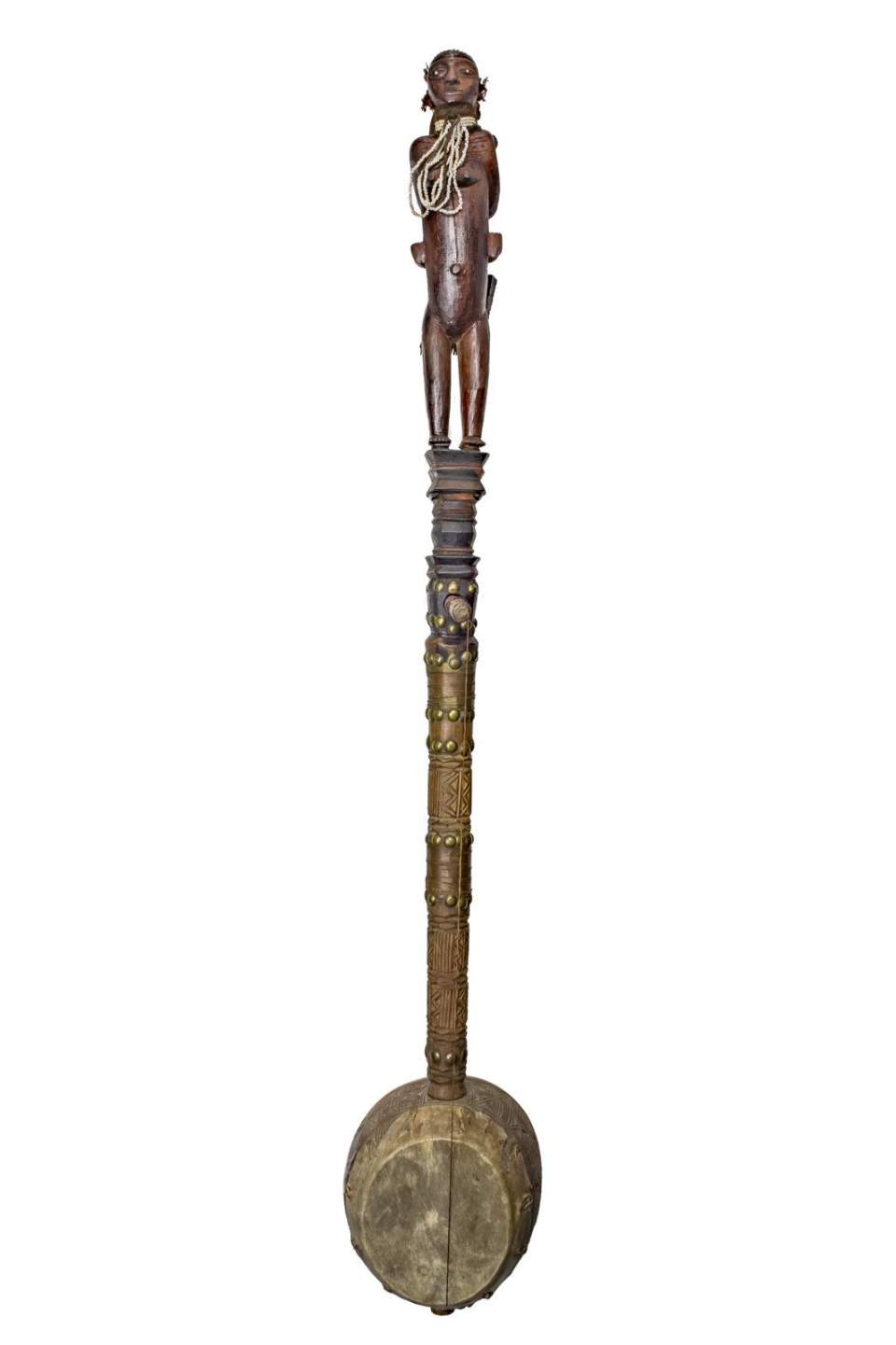 Monochord mit Mutter-Kind-Figur und angehängtem Kamm