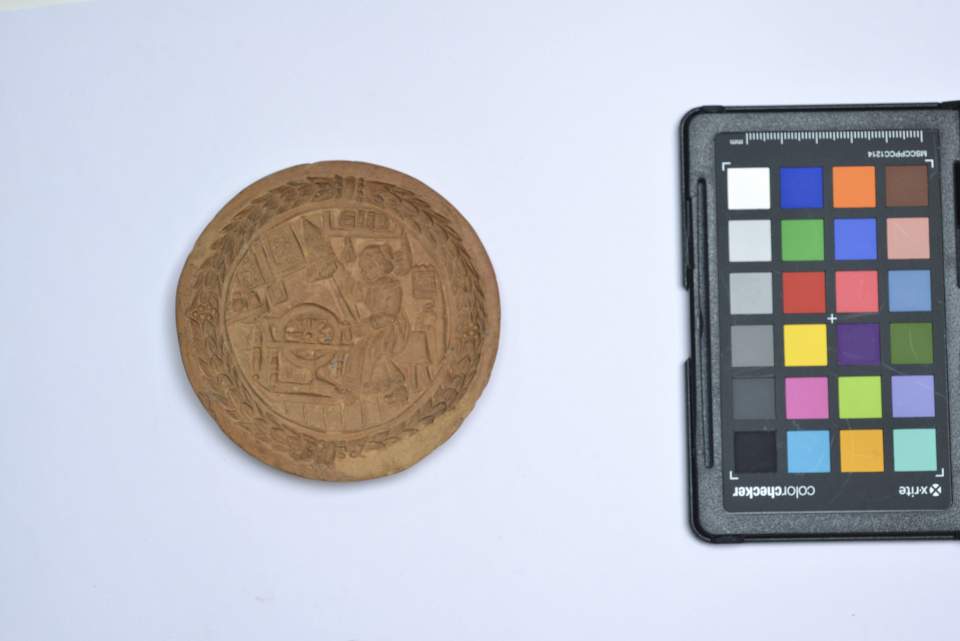 Gebäckmodel mit Frau am Spinnrad aus der Sammlung der Konditorei Burkart in St.Gallen, Bibermodel