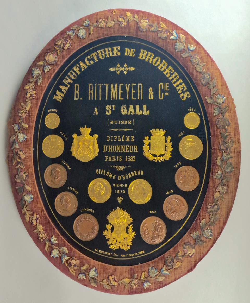 Tafel mit Medaillen der Firma Rittmeyer