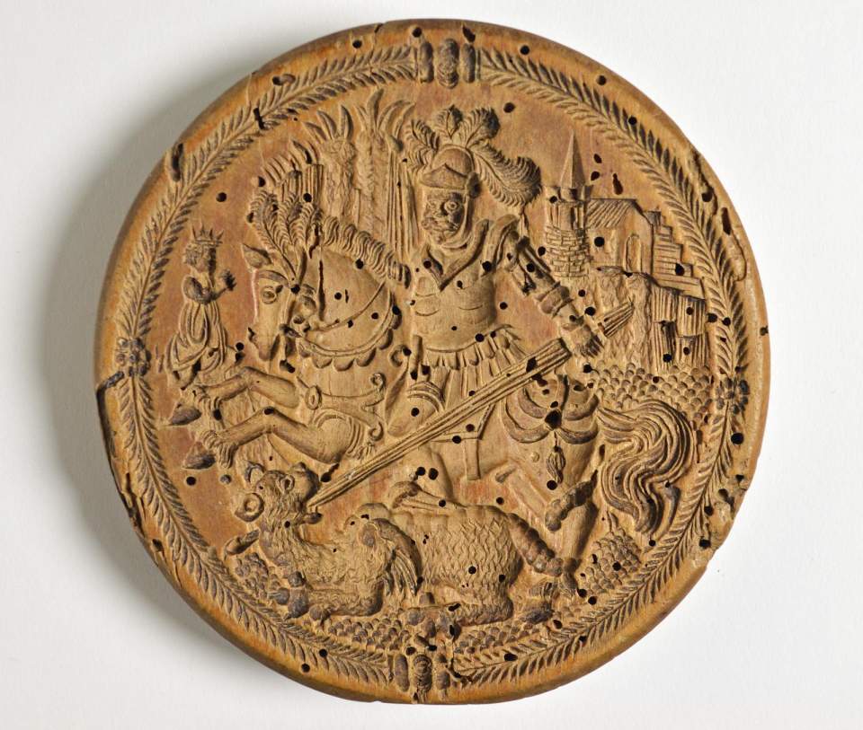 Doppelseitiges Gebäckmodel mit Heiligem Georg als Drachentöter und Löwen
